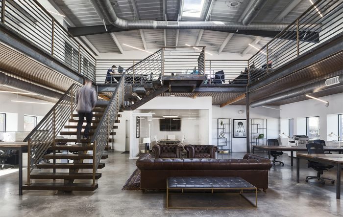 Image shows how mezzanines can be built into converted warehouses to maximise floor space and compliment the buildings design. Mezzanine inspiration for warehouse renovations.