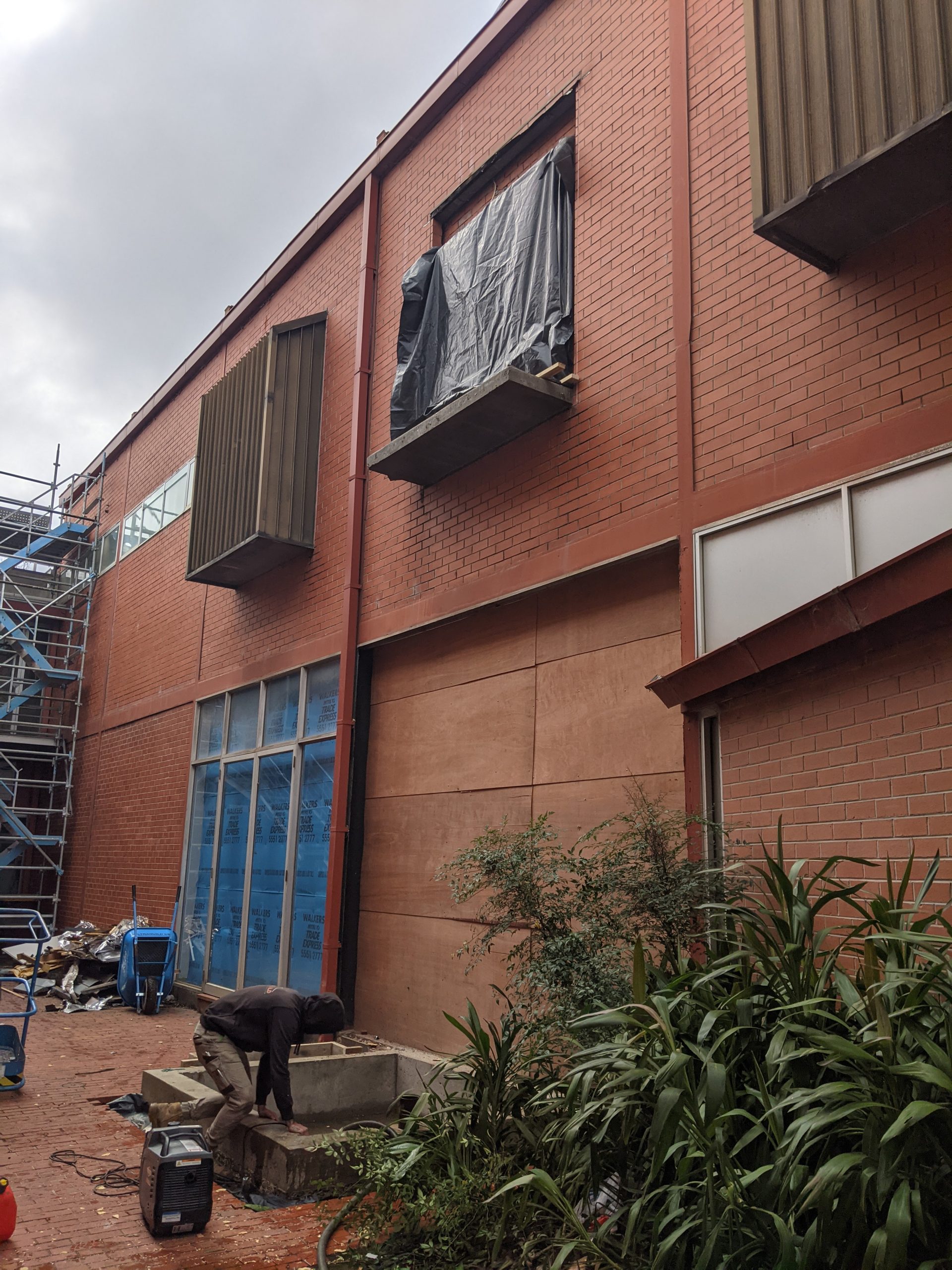 an external wall of a building with a space for an elevator entrance on the second floor