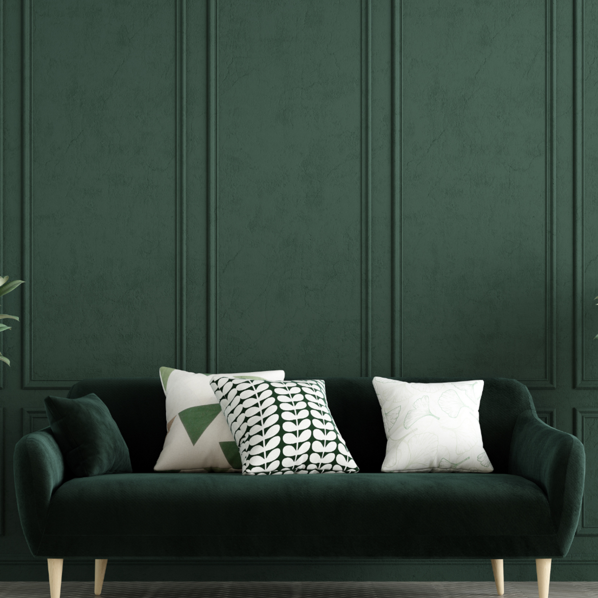 colour drenched green wall featuring green couch with white cushions