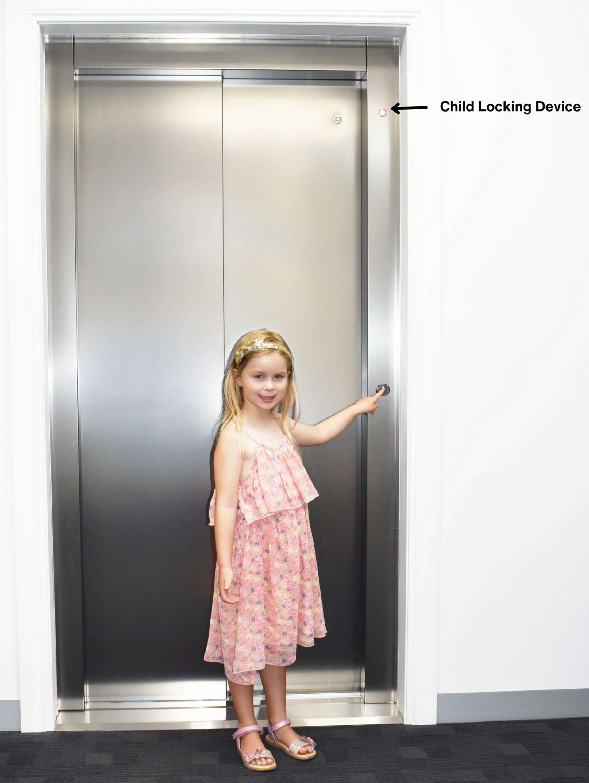 child standing in front of a home elevator