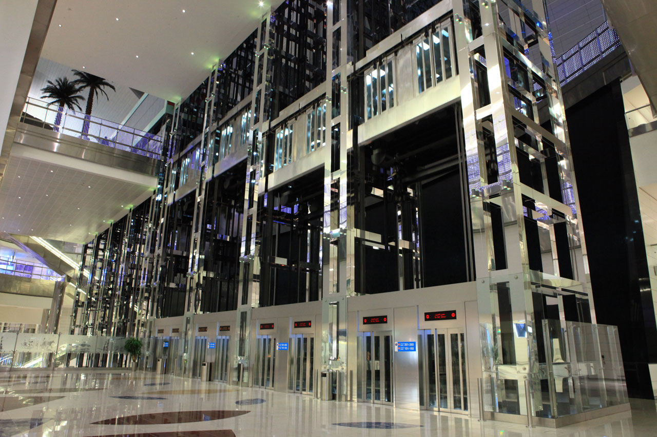 Modern glass elevators in a spacious atrium