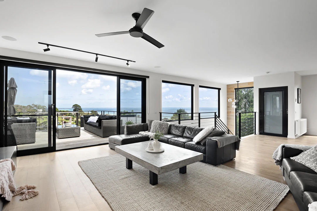 Modern living room with ocean views and balcony