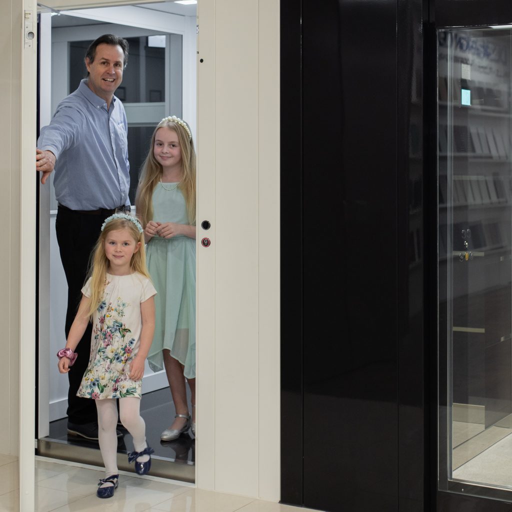 Family using modern residential lift