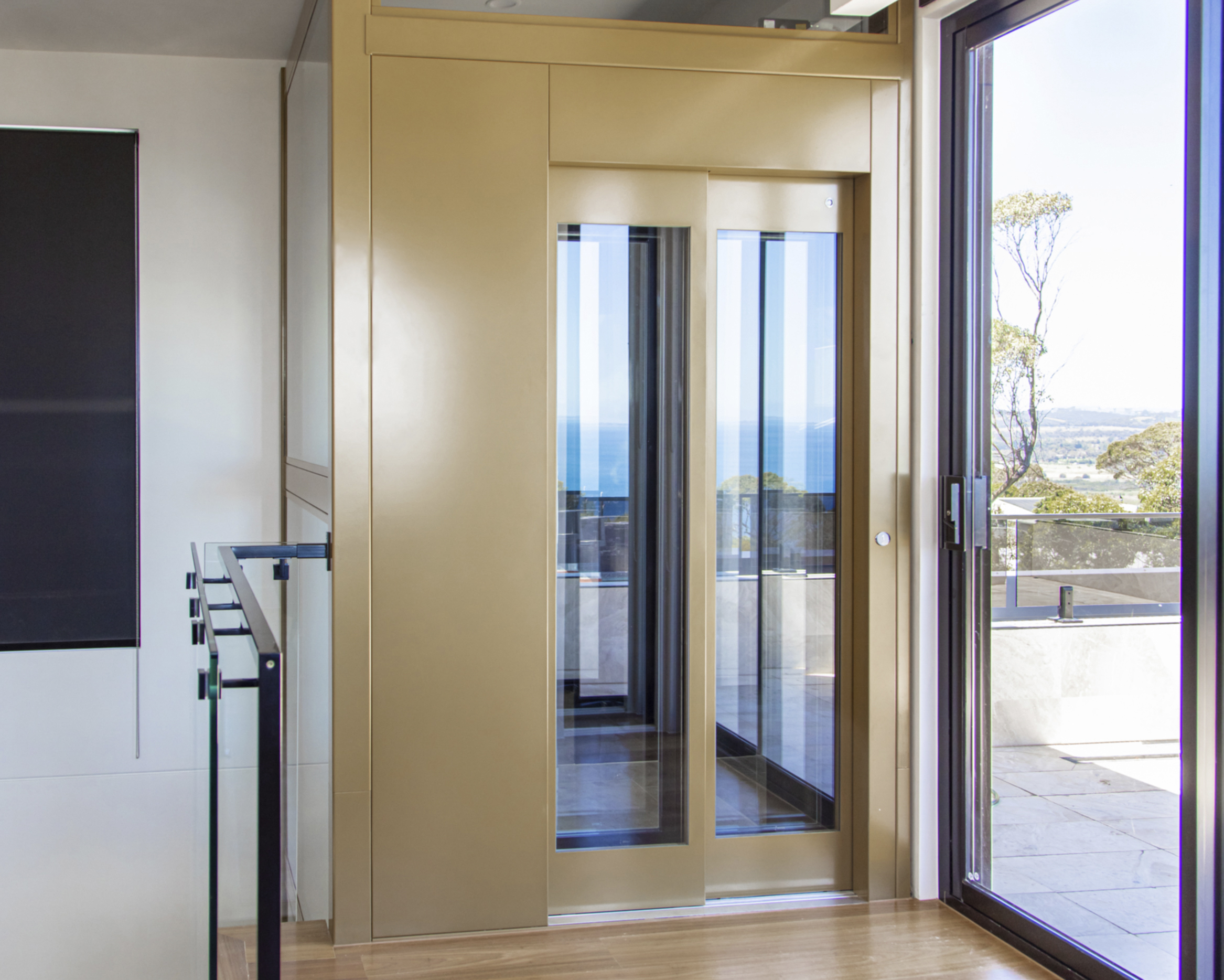 Modern home elevator with coastal view