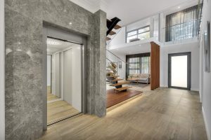 Modern home interior with elevator and staircase.