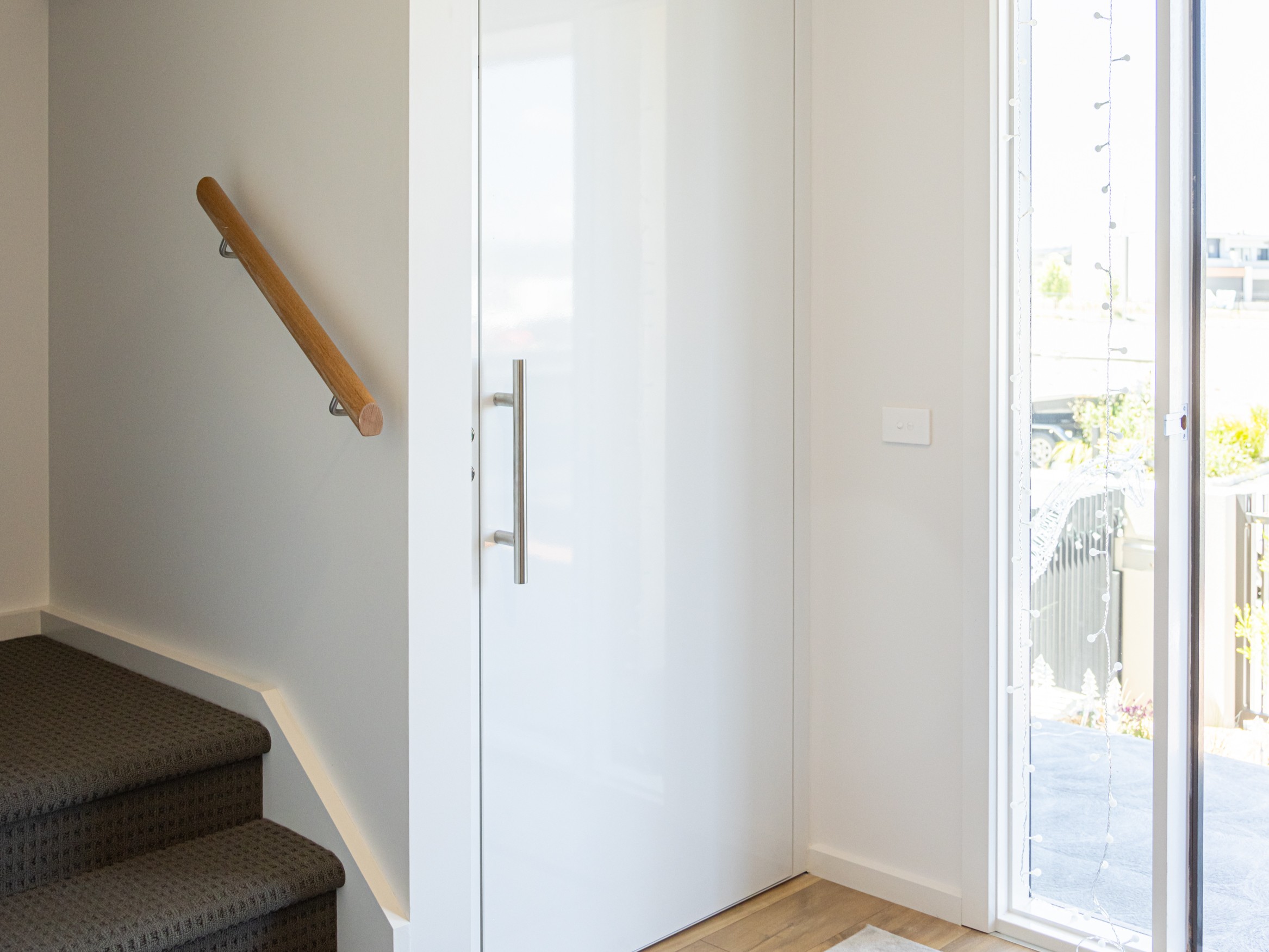 Modern entrance with stairs and sunlight