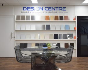 Interior design centre with material samples on shelves.