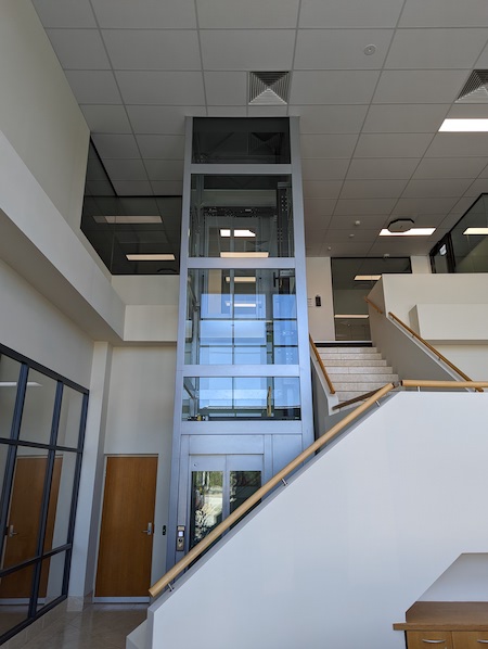 Commercial lift2 commercial elevator beside staircase in office building