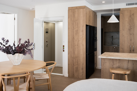 Residential lift2 Modern apartment kitchen with integrated lift access.