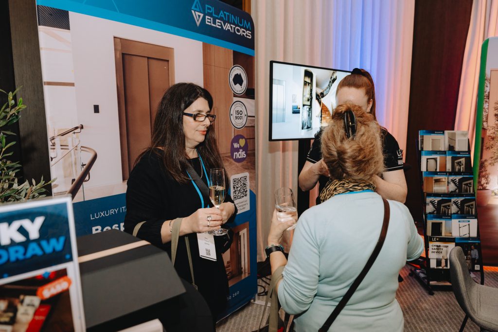 Sonna studios People networking at elevator industry event.