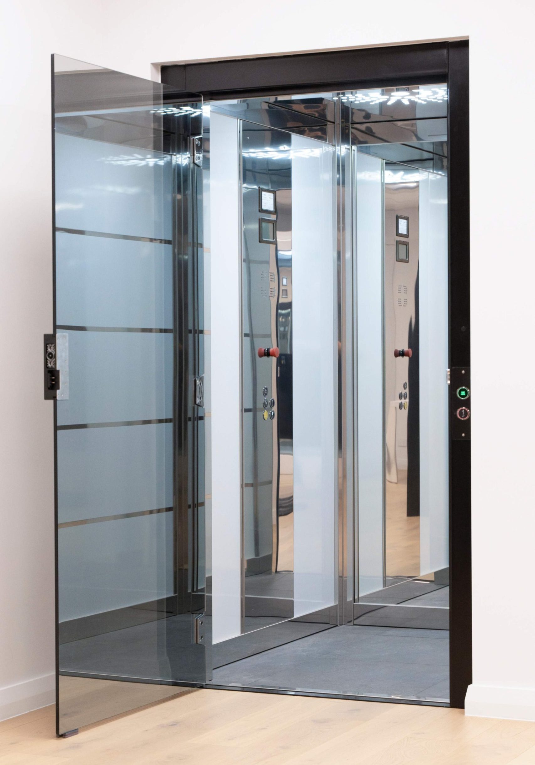 Modern glass lift with open door visible.